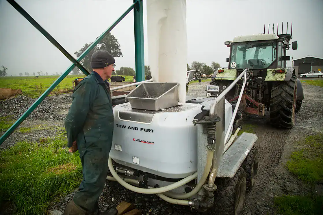 Ian Maxwell filling a Tow and Fert machine before spraying dissolved nitrogen on pasture